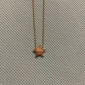 14 K gold plated star with diamond accent.